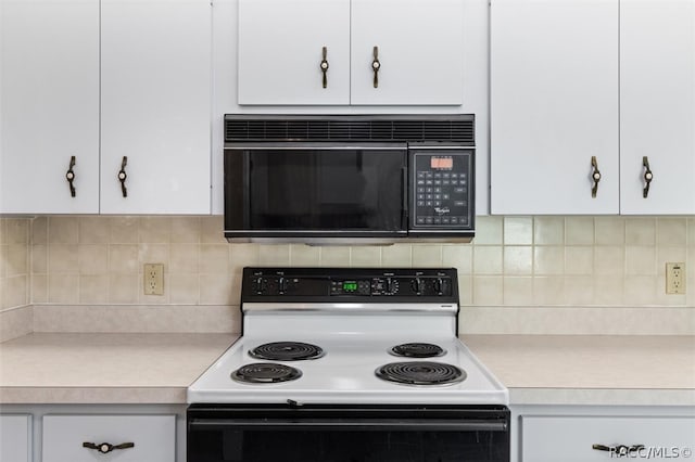 kitchen featuring decorative backsplash, white cabinetry, and electric stove