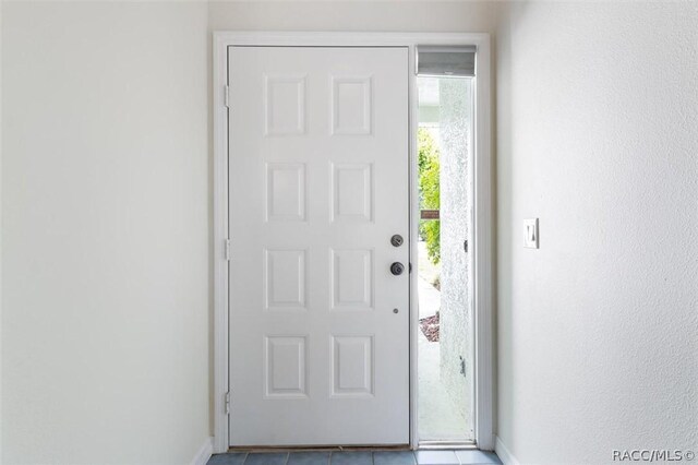 820 Inverie Dr, Inverness, FL 34453 - tiled foyer entrance featuring baseboards
