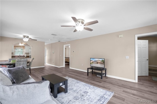 835 N Rembrandt Way, Inverness, FL 34453 - living area with a ceiling fan and wood finished floors