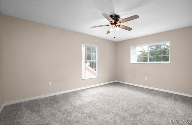 835 N Rembrandt Way, Inverness, FL 34453 - unfurnished room with healthy amount of natural light, carpet floors, and a ceiling fan