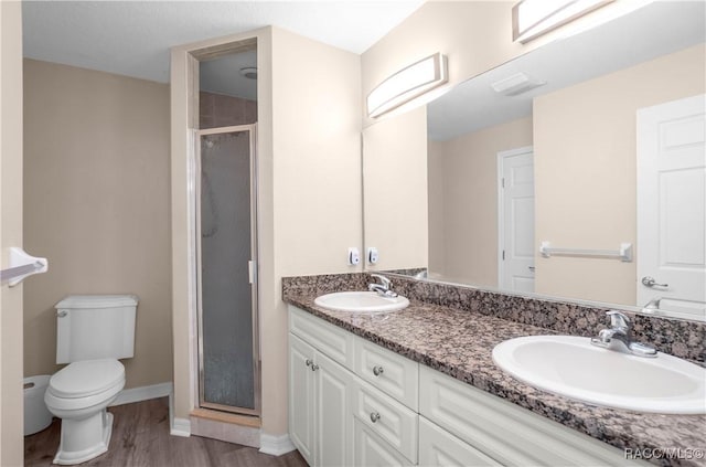 835 N Rembrandt Way, Inverness, FL 34453 - full bath with a shower stall, double vanity, and wood finished floors