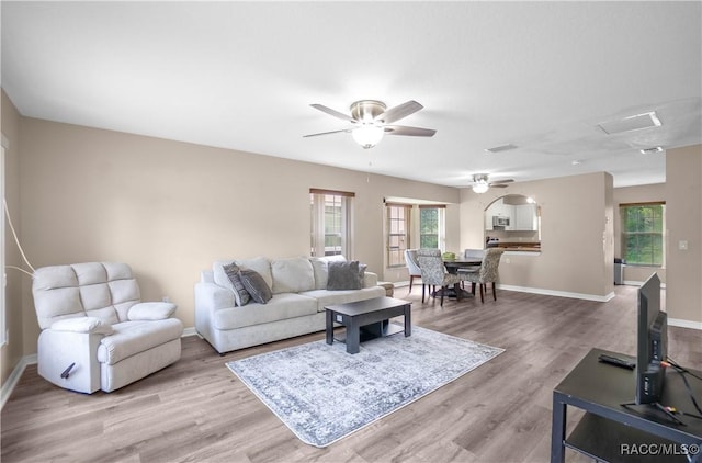 835 N Rembrandt Way, Inverness, FL 34453 - living area with light wood-type flooring, ceiling fan, and attic access