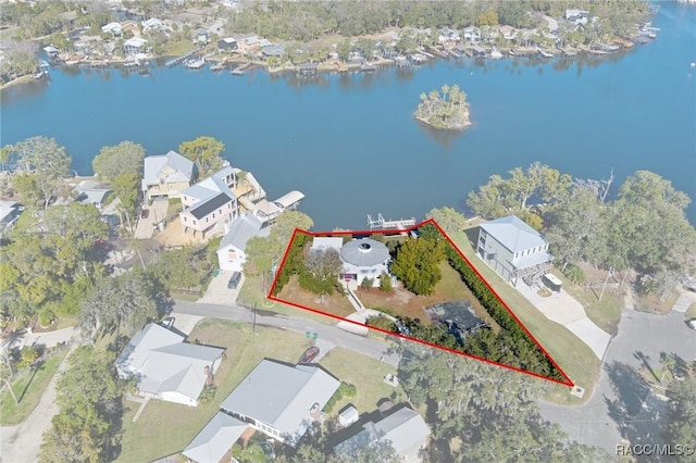 birds eye view of property featuring a water view and a residential view