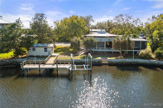 view of dock featuring a water view and boat lift