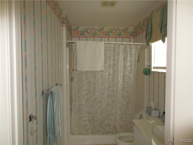 bathroom with vanity, toilet, and walk in shower