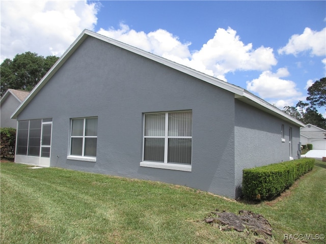 view of home's exterior featuring a lawn