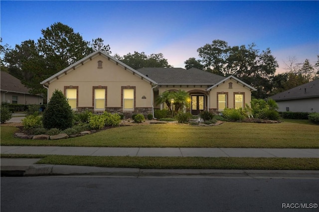 view of front of property with a lawn