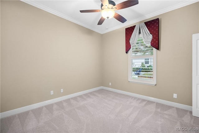 unfurnished room with crown molding, light colored carpet, and ceiling fan