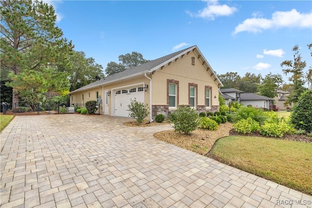 view of home's exterior featuring a garage and a yard