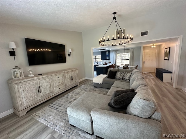 living room featuring hardwood / wood-style floors and a textured ceiling