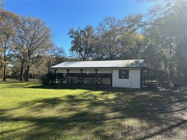 view of outdoor structure with a lawn