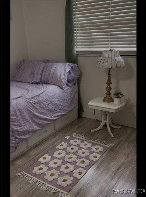 bedroom featuring hardwood / wood-style floors