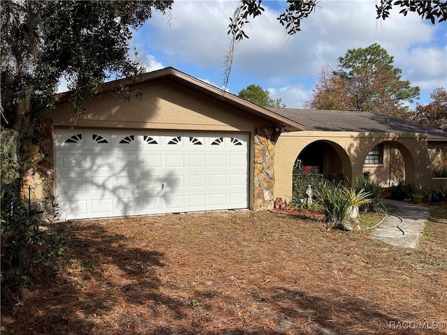 ranch-style home featuring a garage