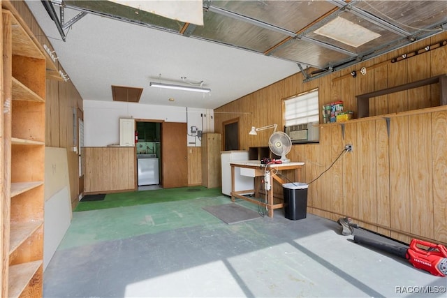 5761 S Eaton Ter, Inverness, FL 34452 - garage with washer / clothes dryer, wood walls, and cooling unit