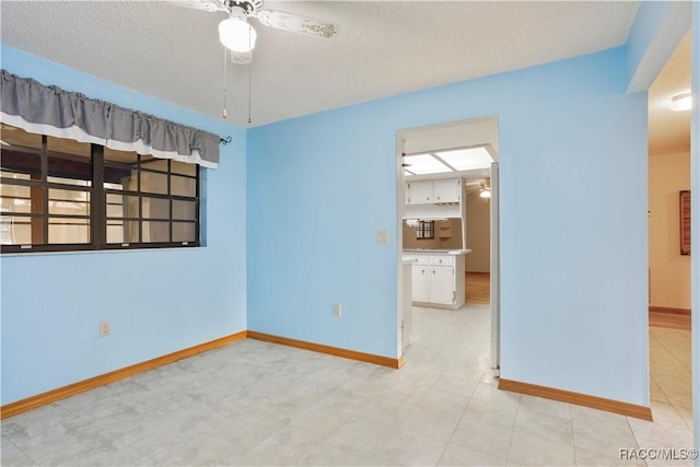 5761 S Eaton Ter, Inverness, FL 34452 - unfurnished room featuring ceiling fan, baseboards, and a textured ceiling