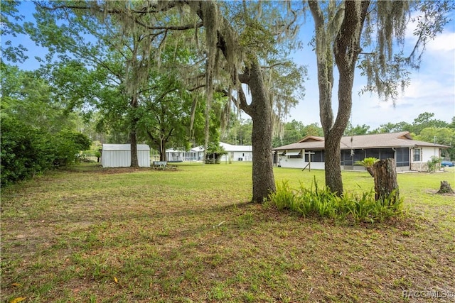 5761 S Eaton Ter, Inverness, FL 34452 - view of grassy yard with a sunroom