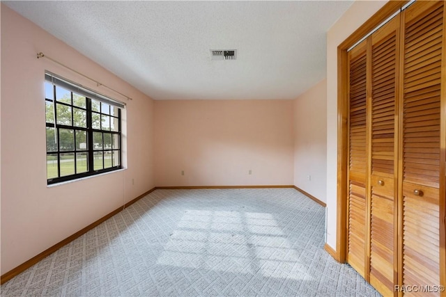 5761 S Eaton Ter, Inverness, FL 34452 - unfurnished bedroom with light colored carpet, a closet, and baseboards