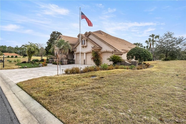 view of property exterior featuring a garage and a yard