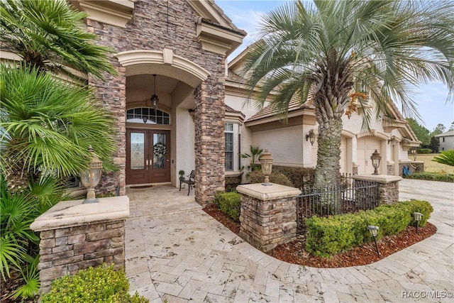 entrance to property featuring french doors