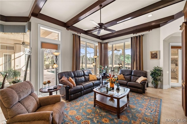 living room featuring beam ceiling, ceiling fan, and light tile patterned flooring