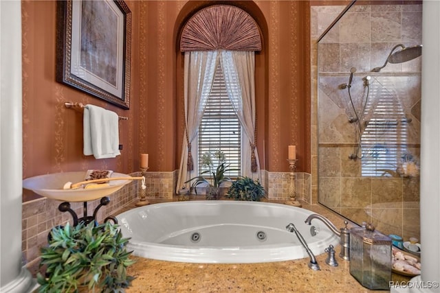 bathroom featuring separate shower and tub