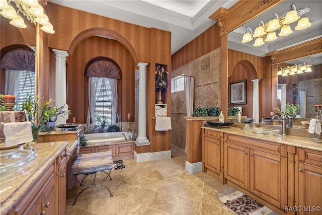 bathroom featuring crown molding, a wealth of natural light, and ornate columns