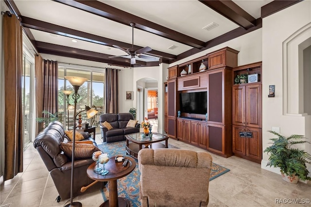 tiled living room featuring beamed ceiling and ceiling fan