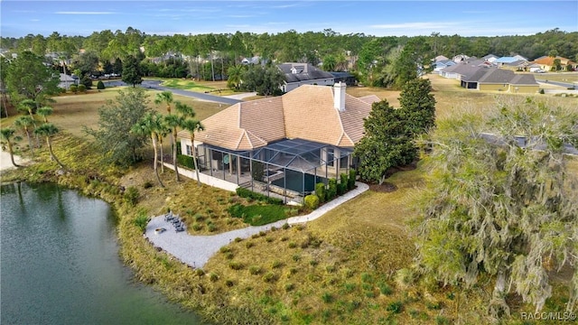 birds eye view of property with a water view