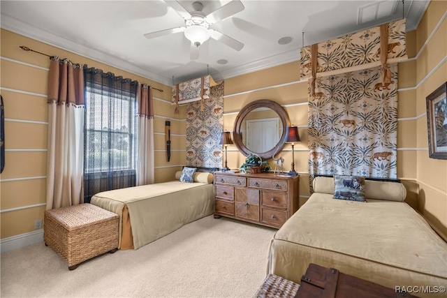 carpeted bedroom featuring ornamental molding and ceiling fan