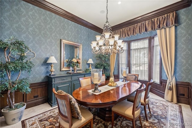 dining area featuring crown molding, light tile patterned floors, and an inviting chandelier