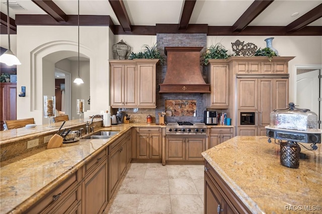 kitchen featuring premium range hood, sink, hanging light fixtures, stainless steel gas stovetop, and backsplash