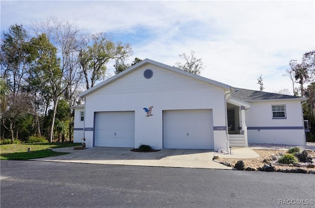 single story home featuring a garage