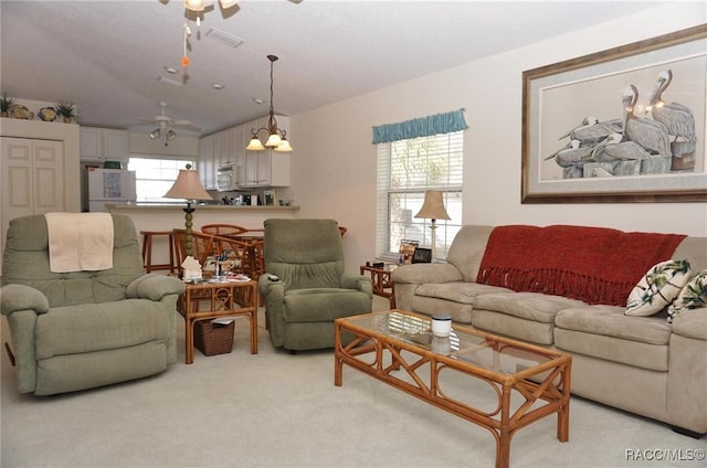 living room with light carpet and ceiling fan