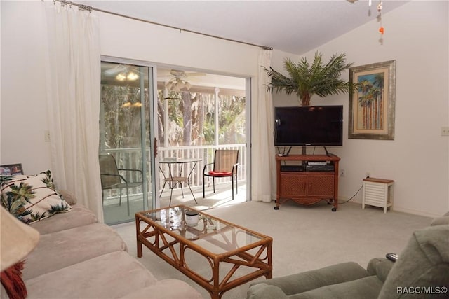 carpeted living room with ceiling fan