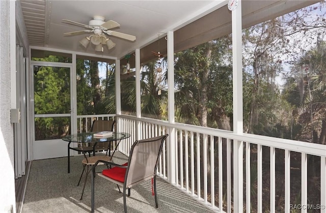 sunroom / solarium featuring ceiling fan