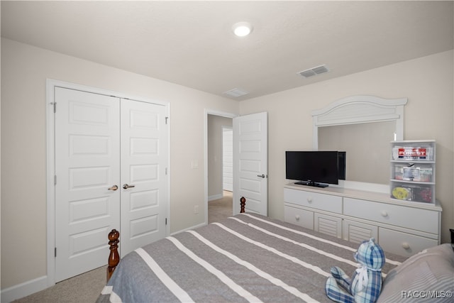 bedroom with carpet and a closet