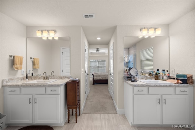 bathroom featuring vanity and a textured ceiling