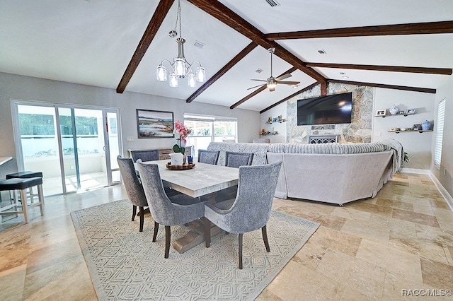 dining room with ceiling fan with notable chandelier and lofted ceiling with beams