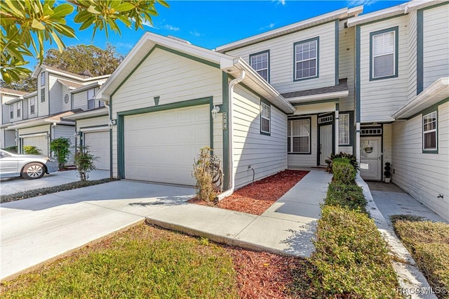 townhome / multi-family property featuring a garage