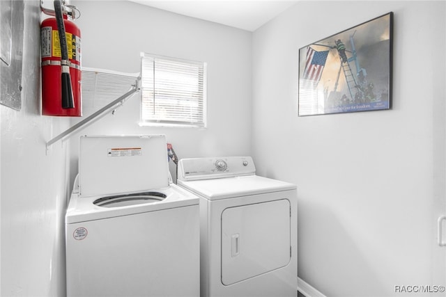 laundry room featuring separate washer and dryer