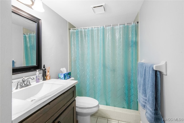 bathroom featuring tile patterned floors, vanity, a shower with shower curtain, and toilet