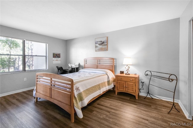 bedroom featuring dark wood-type flooring