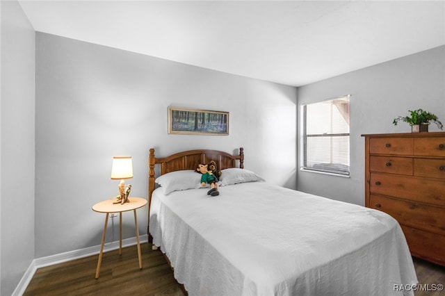 bedroom featuring dark wood-type flooring