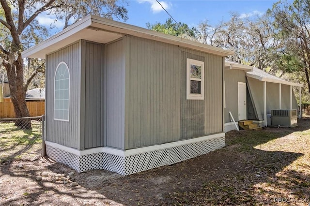 383 S Rooks Ave, Inverness, FL 34453 - view of outbuilding featuring entry steps, fence, and central AC