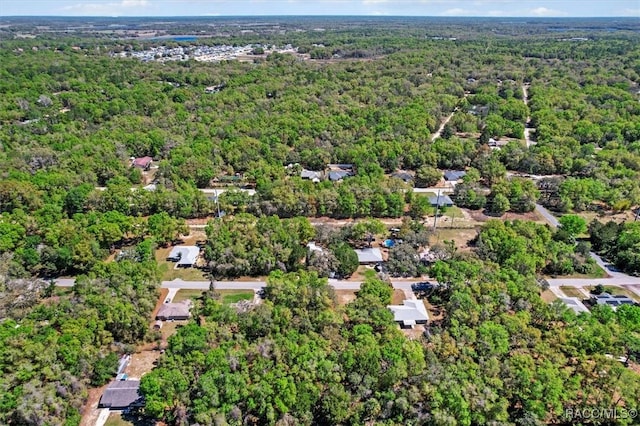 383 S Rooks Ave, Inverness, FL 34453 - drone / aerial view featuring a wooded view