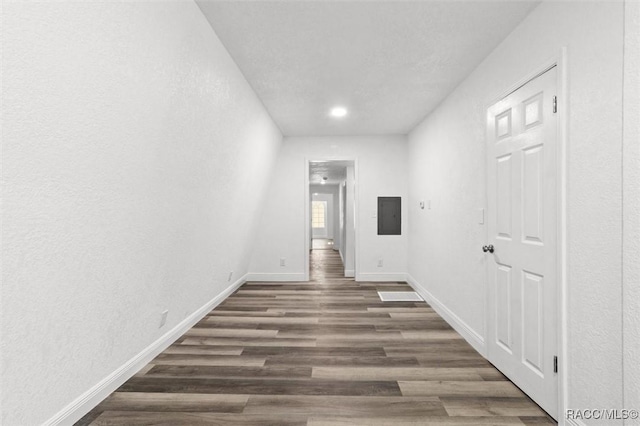 383 S Rooks Ave, Inverness, FL 34453 - hall with electric panel, baseboards, and wood finished floors