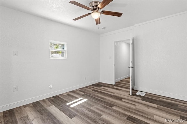 383 S Rooks Ave, Inverness, FL 34453 - empty room with baseboards, wood finished floors, and a ceiling fan
