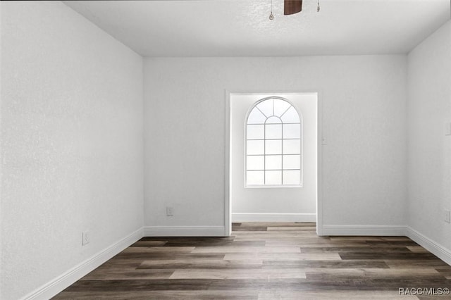 383 S Rooks Ave, Inverness, FL 34453 - unfurnished room featuring baseboards, wood finished floors, and ceiling fan
