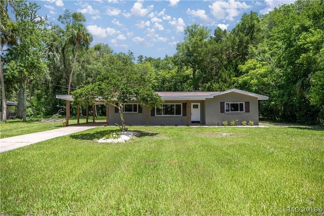 1361 NW 19th St, Crystal River, FL 34428 - ranch-style home with driveway, a front yard, and an attached carport
