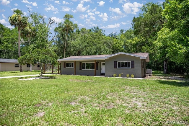1361 NW 19th St, Crystal River, FL 34428 - ranch-style house featuring a front yard